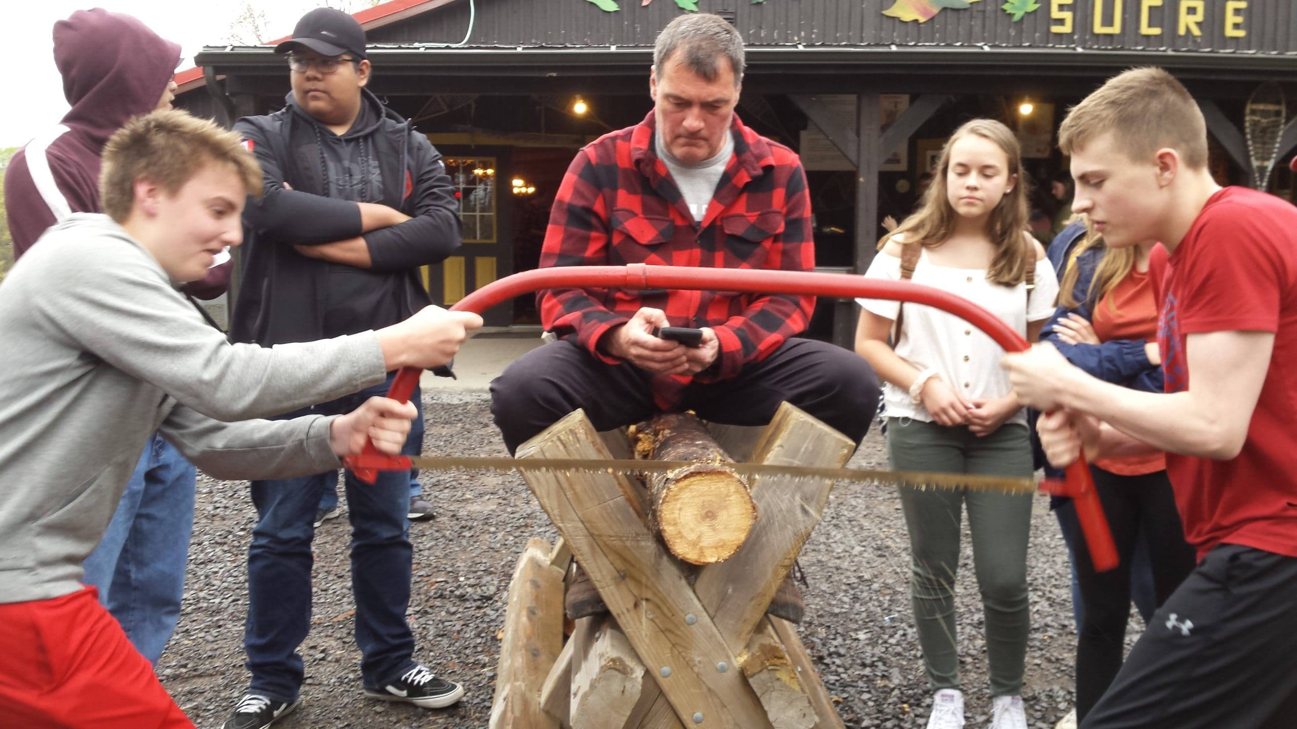 students learn to saw wood