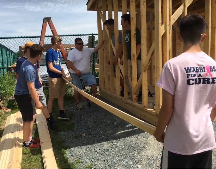 students building shed