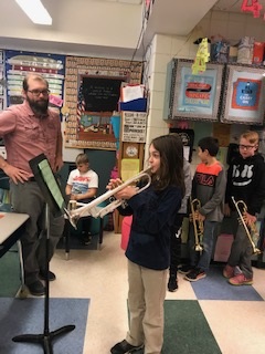 student plays the trumpet