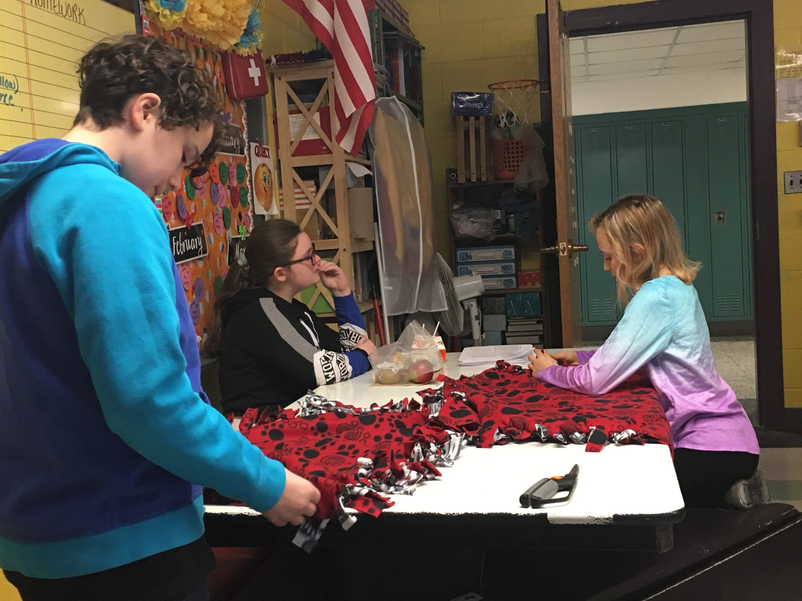 sudents working on making blankets