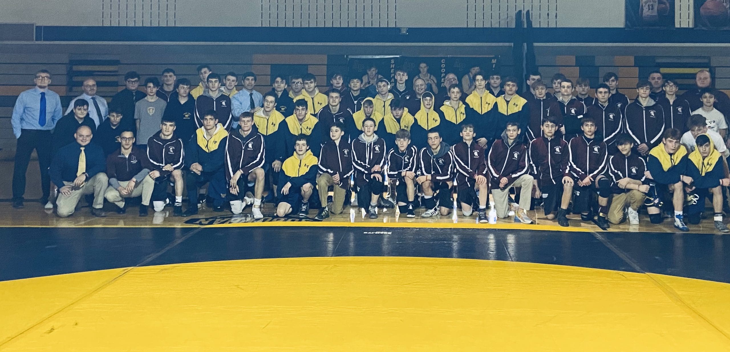group photo of wrestling teams