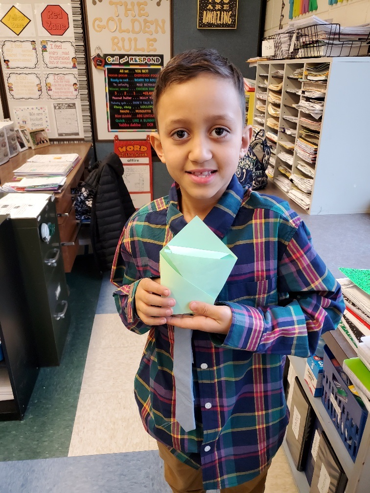 student with origami