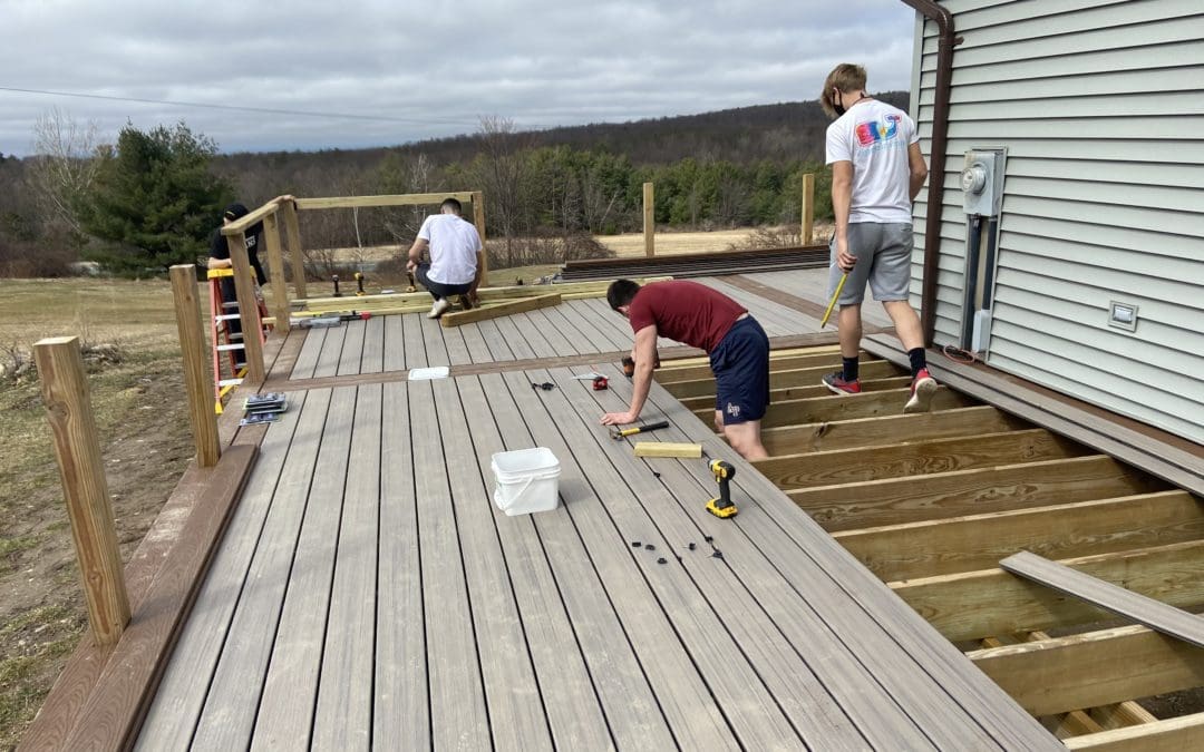 students working on deck