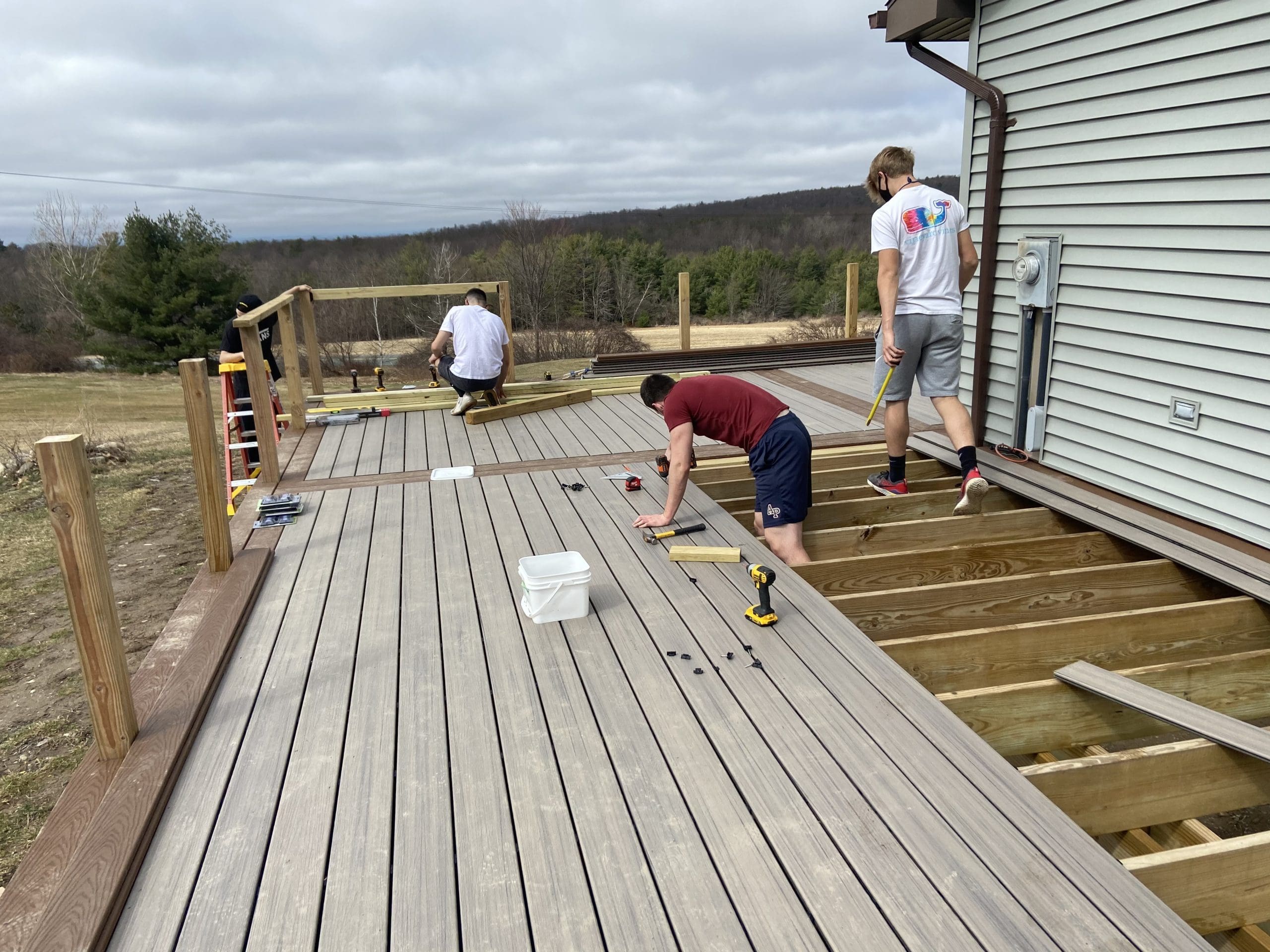 students working on deck