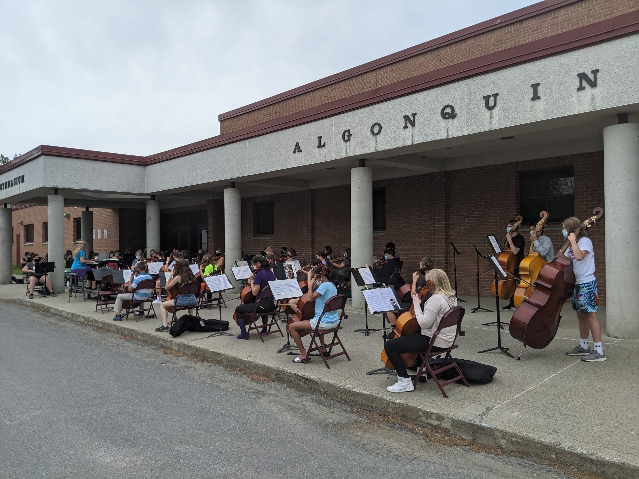 students performing outside