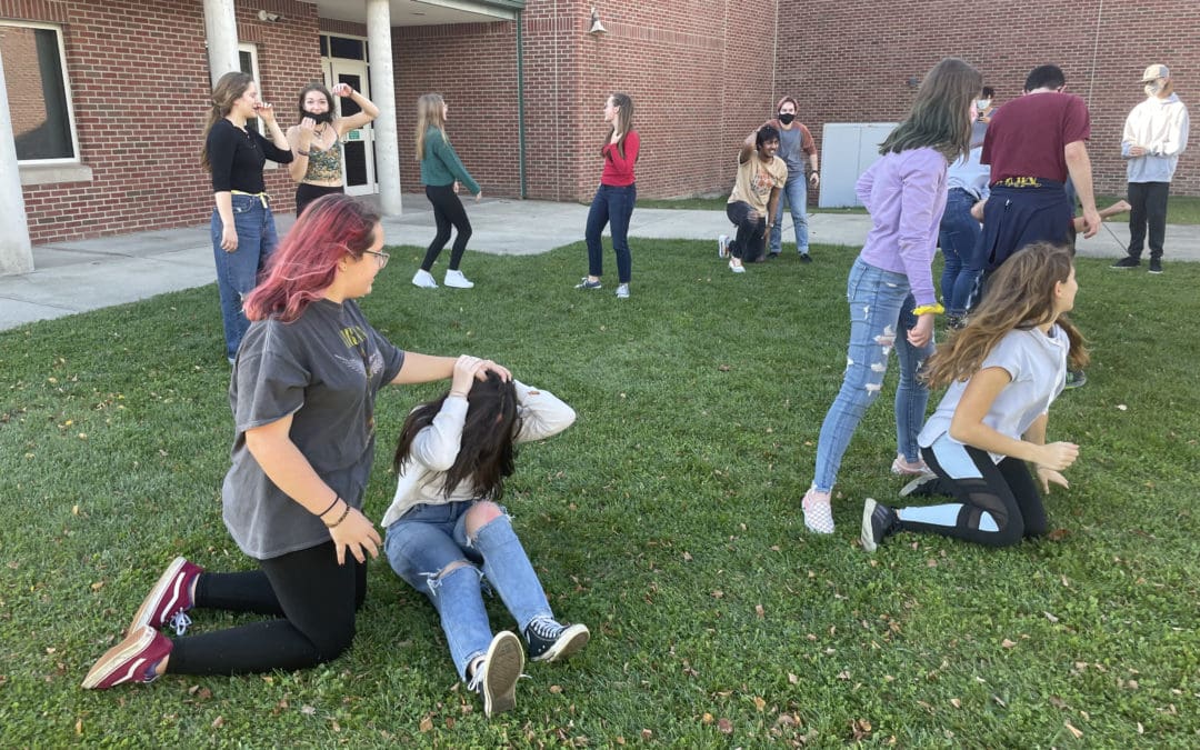 students practicing outside