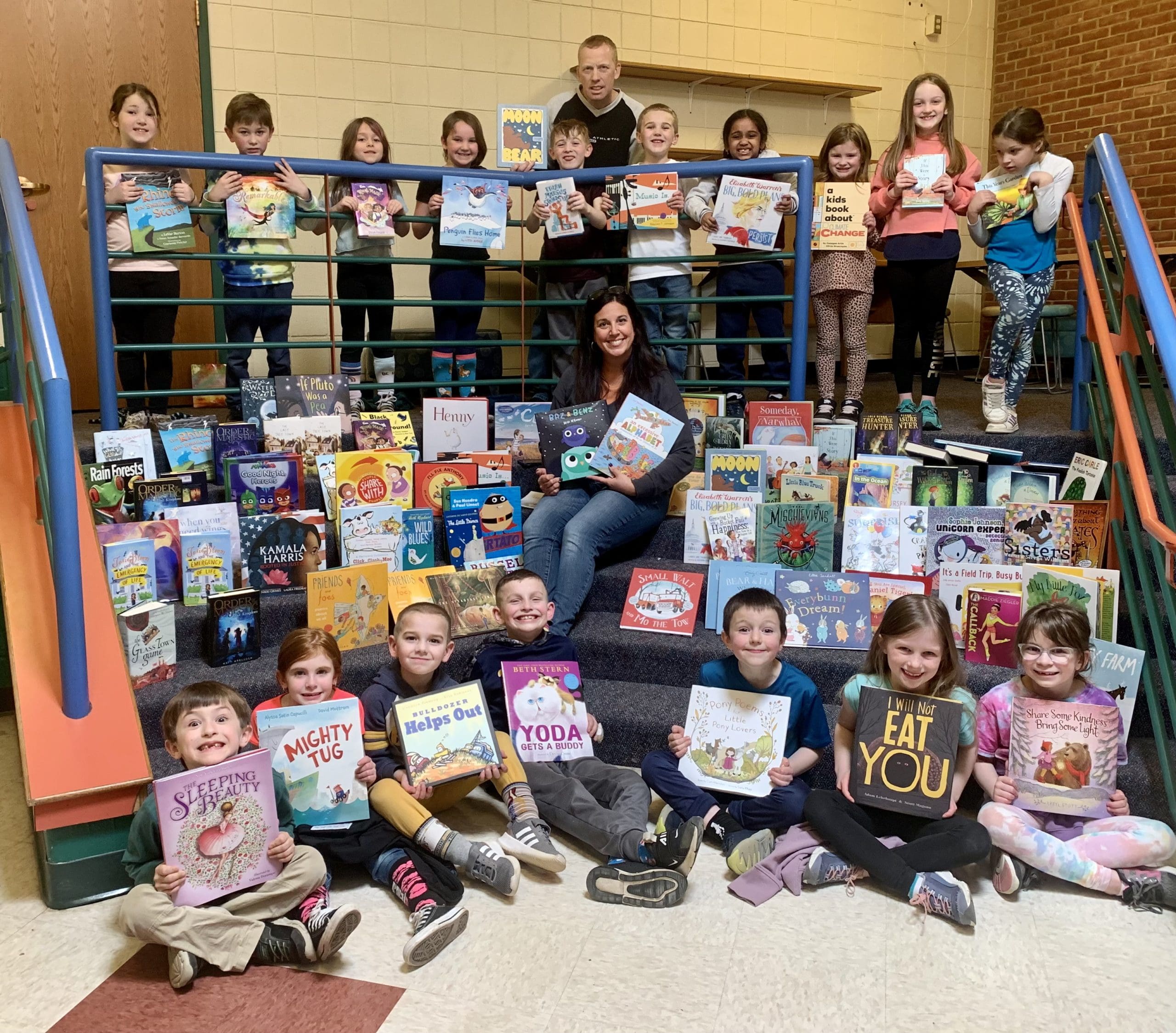 Teachers and students with books